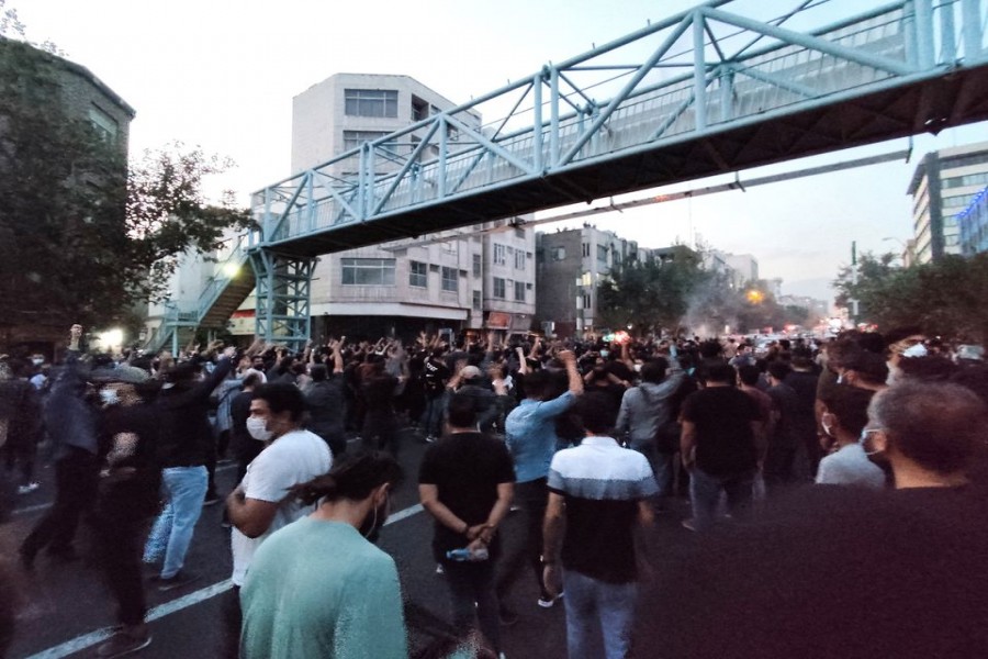 People attend a protest over the death of Mahsa Amini, a woman who died after being arrested by the Islamic republic's "morality police", in Tehran, Iran September 21, 2022. WANA (West Asia News Agency) via REUTERS