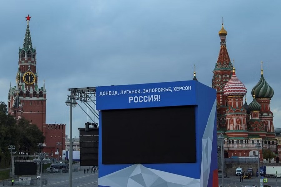 A view shows a screen, set up ahead of an expected ceremony and concert to declare four Ukraine's self-proclaimed regions part of Russia following recent referendums, near St. Basil's Cathedral and the Kremlin's Spasskaya Tower in central Moscow, Russia September 29, 2022. A slogan on the screen reads: "Donetsk, Luhansk, Zaporizhzhia, Kherson - Russia!" REUTERS