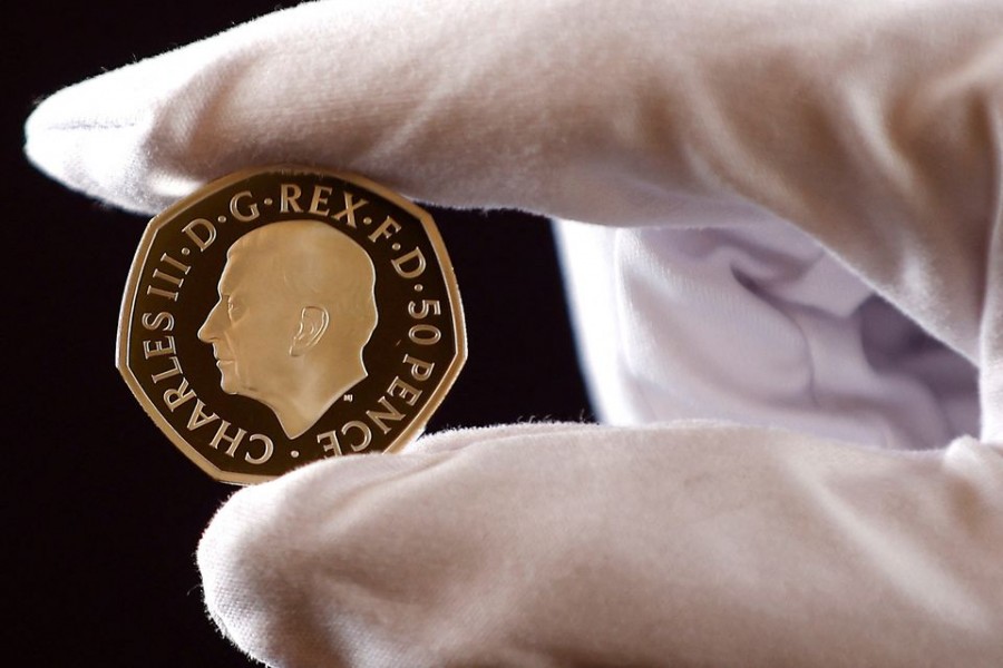 The official coin effigy of Britain’s King Charles III is seen on a 50 pence coin, unveiled by The Royal Mint, in London, Britain, September 29, 2022. REUTERS/Peter Nicholls