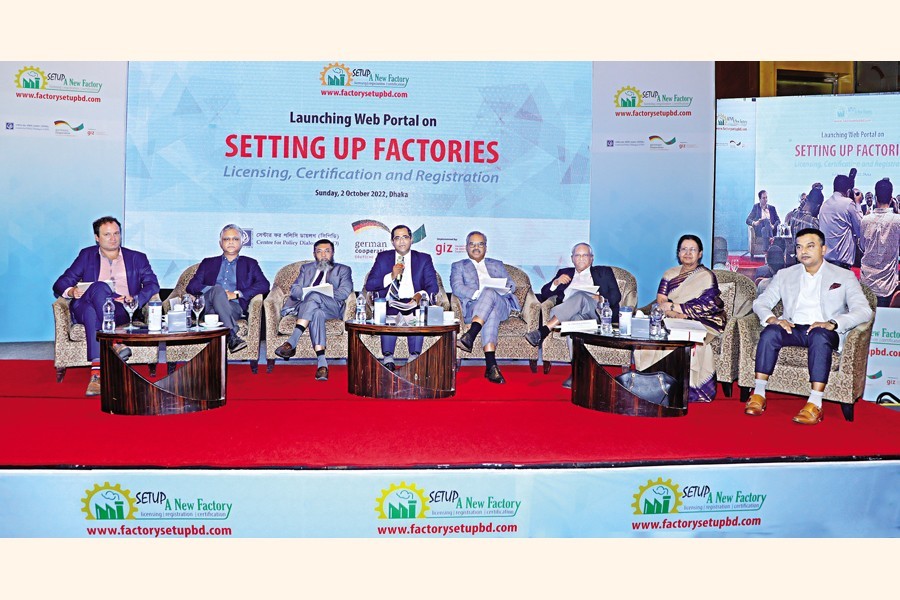 Centre for Policy Dialogue (CPD) Research Director Dr Khondaker Golam Moazzem speaks at a discussion titled "Launching Web Portal on Setting up Factories: Licencing, Certification and Registration", jointly organised by the CPD and the German international development cooperation agency GIZ at a city hotel on Sunday