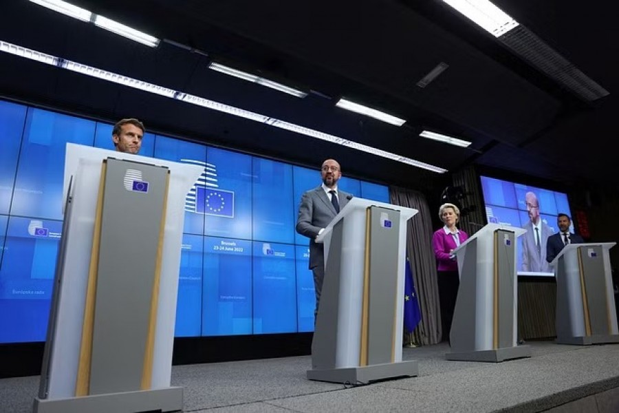 European Council President Charles Michel, European Commission President Ursula von der Leyen and French President Emmanuel Macron attend a news conference during a European Union leaders summit in Brussels, Belgium June 24, 2022. REUTERS