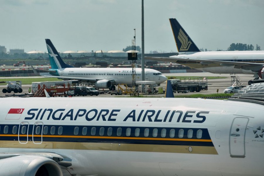 Singapore Airlines planes sit on the tarmac at Changi Airport in Singapore November 16, 2021. REUTERS/Caroline Chia/File Photo