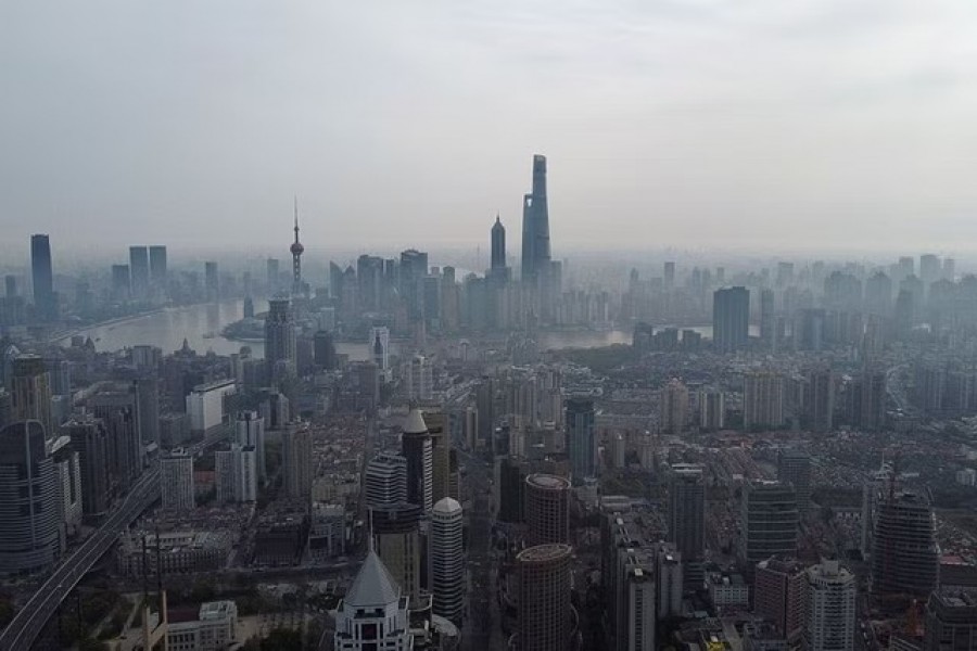 An aerial view shows the Lujiazui financial district and other buildings along the Huangpu river amid a lockdown to contain the spread of the coronavirus disease (COVID-19) in Shanghai, China March 30, 2022. Picture taken with a drone. REUTERS