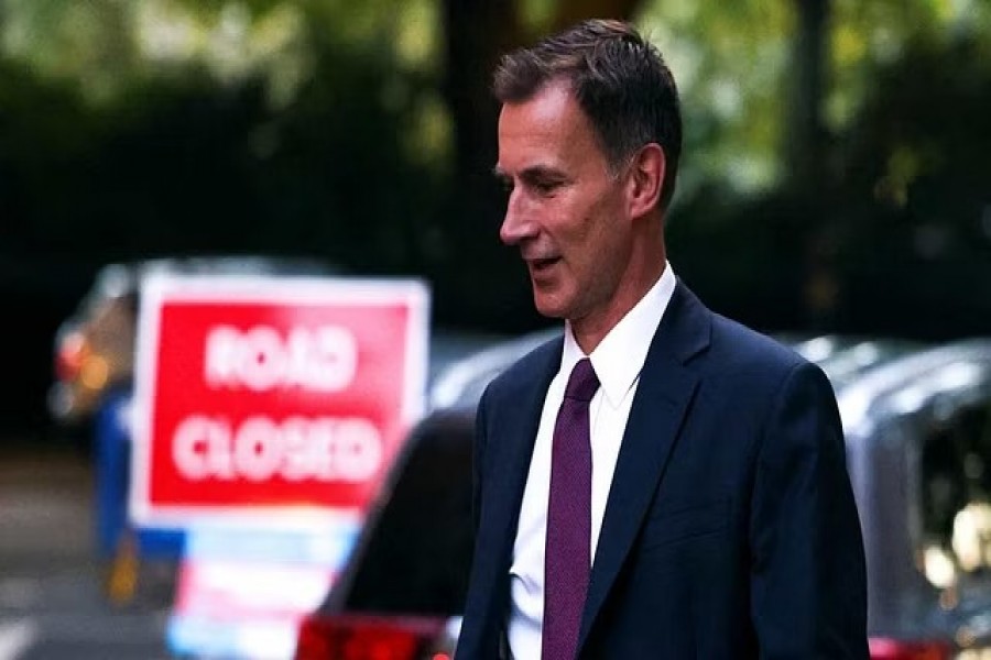 British Chancellor of the Exchequer Jeremy Hunt leaves a tv studio, in London, Britain, Oct 15, 2022.REUTERS