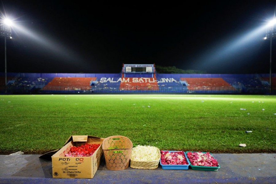 Flower petals are seen inside the Kanjuruhan stadium where a riot and stampede took place following a soccer match between Arema vs Persebaya, in Malang, East Java province, Indonesia, October 2, 2022. REUTERS/Willy Kurniawan/File Photo