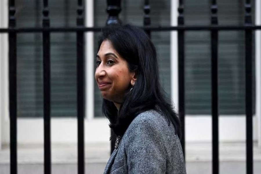 Britain's Secretary of State for the Home Department Suella Braverman walks outside Number 10 Downing Street in London, Britain, October 18, 2022. REUTERS/Toby Melville