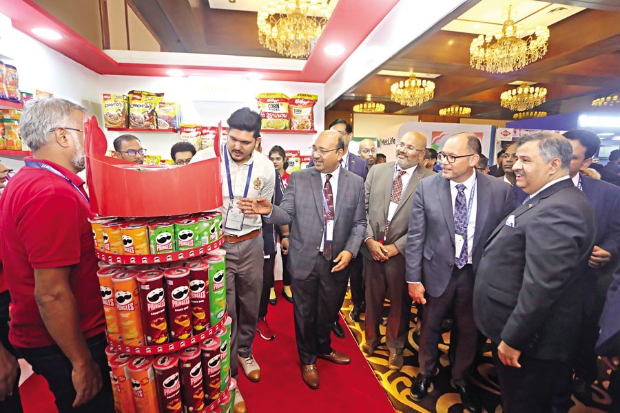 US Ambassador to Bangladesh Peter D Haas goes round different stalls at the 28th US trade show, co-sponsored by the American Chamber of Commerce (AmCham) and the US Embassy, at the Pan Pacific Sonargaon Hotel in Dhaka on Thursday. — FE photo