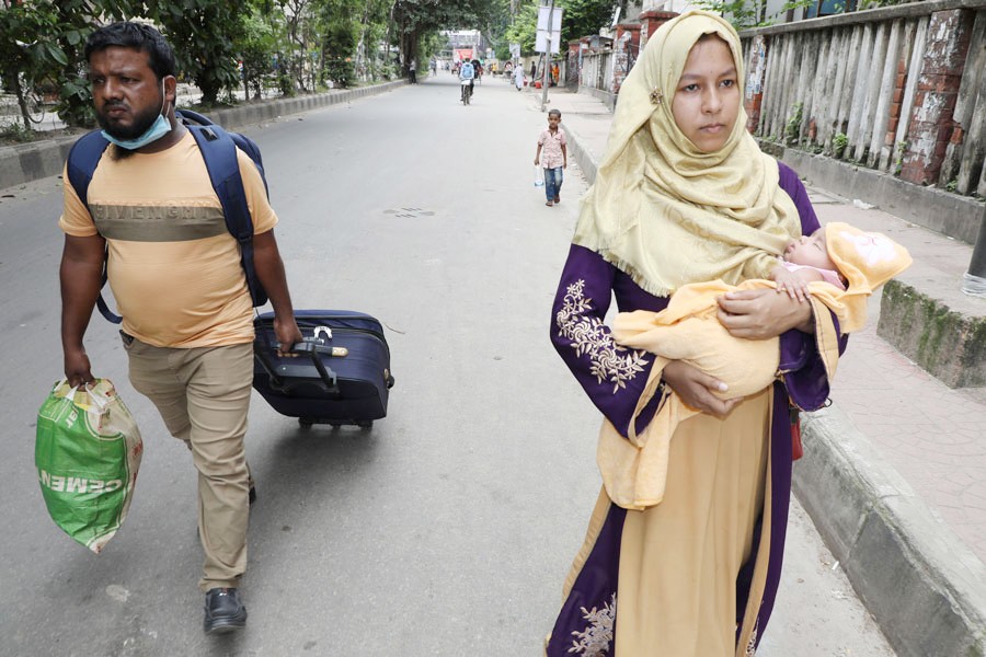 A mother is walking with her new born child. Child mortality rate has improved significantly in Bangladesh. 	—FE File Photo