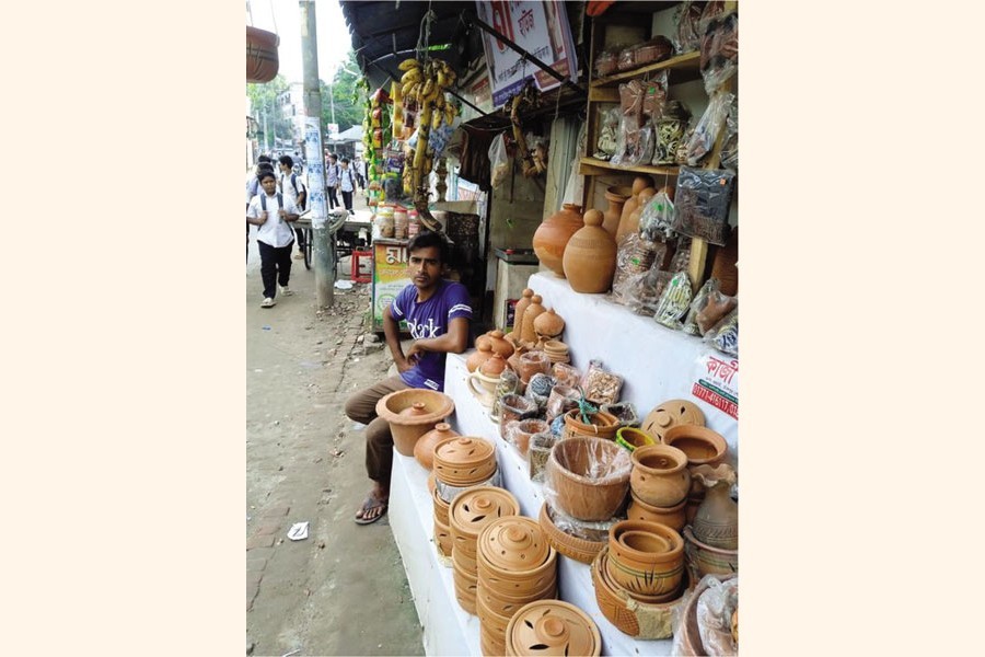 Photo shows pottery items on display at a roadside shop in Chandpur — FE Photo