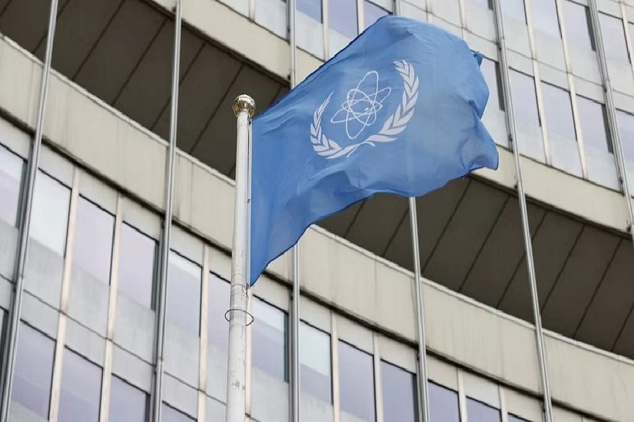 The flag of the International Atomic Energy Agency (IAEA) waves in front its headquarters, amid the coronavirus disease (COVID-19) pandemic, in Vienna, Austria, May 23, 2021. REUTERS