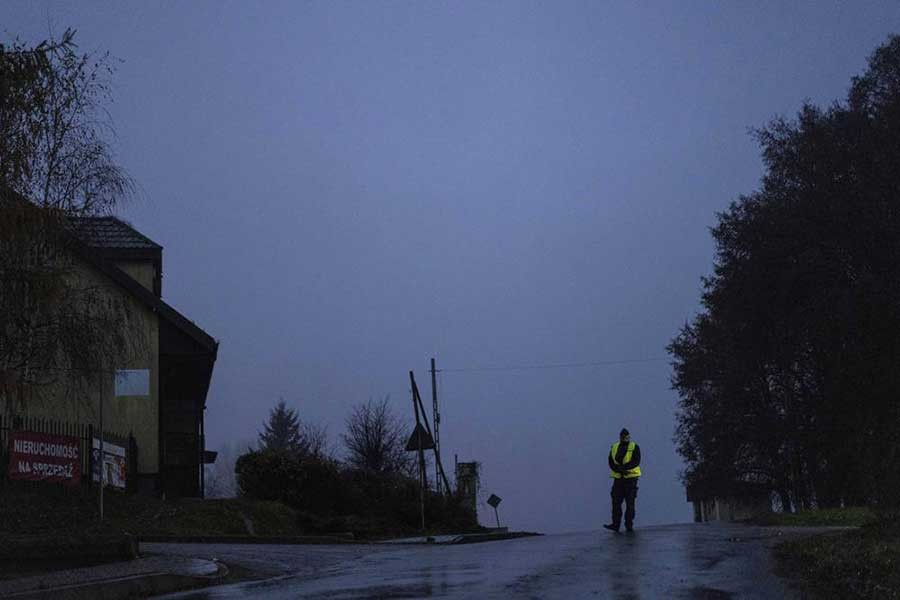 A police officer standing at a checkpoint near the scene of a blast in Przewodow in Poland on Wednesday –AP Photo