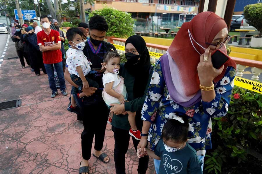 Malaysians waiting in a queue to cast their vote for the country's general election at Permatang Pauh in Penang of Malaysia on Saturday –Reuters photo