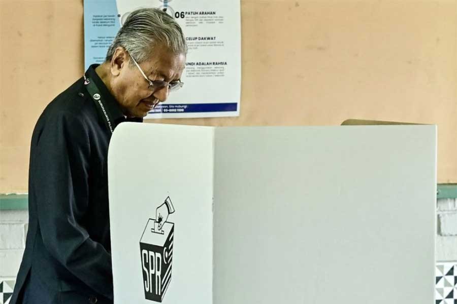 Former Malaysia Prime Minister Mahathir Mohamad casting his vote for the country's general election in Malaysia on Saturday –Reuters photo