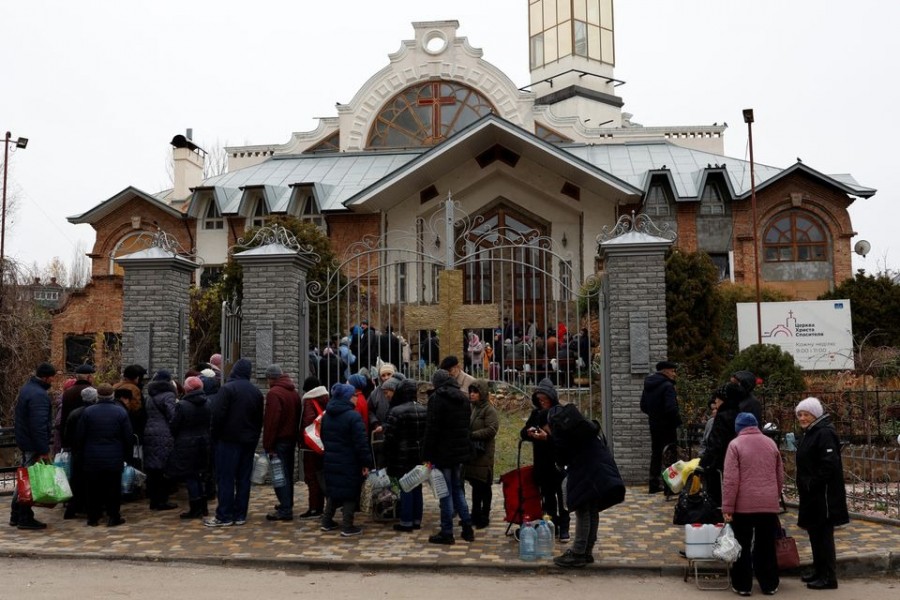 People wait in line to get food, water and aid after Russia's military retreat from Kherson, outside the Church of Christ the Savior in Kherson, Ukraine on November 22, 2022 — Reuters photo