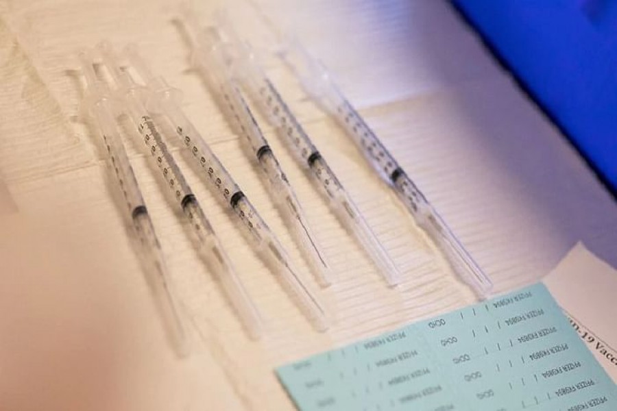 Syringes ready to be administered to residents who are over 50 years old and immunocompromised and are eligible to receive their second booster shots of the coronavirus disease (COVID-19) vaccines are seen in Waterford, Michigan, US, Apr 8, 2022. REUTERS