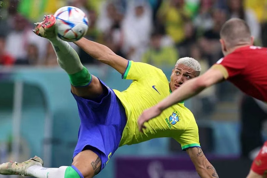 Football - FIFA World Cup Qatar 2022 - Group G - Brazil v Serbia - Lusail Stadium, Lusail, Qatar - November 24, 2022 Brazil's Richarlison cores their second goal. REUTERS