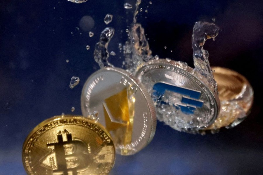 Representations of cryptocurrencies plunge into water in this illustration taken on May 23, 2022 — Reuters/Files