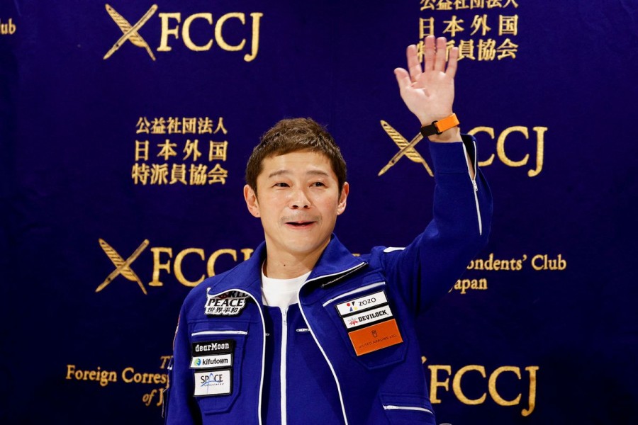Japanese billionaire Yusaku Maezawa, who returned to Earth last month after a 12-day journey into space, attends a news conference after returning to Japan at the Foreign Correspondents' Club of Japan, in Tokyo, Japan January 7, 2022. REUTERS/Issei Kato/Files