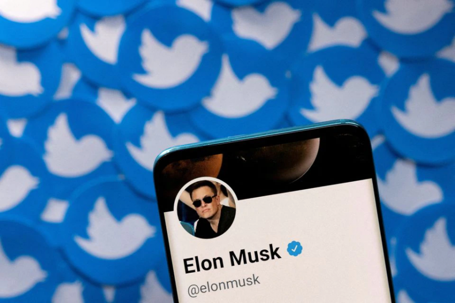 Elon Musk's Twitter profile is seen on a smartphone placed on printed Twitter logos in this picture illustration taken on April 28, 2022 — Reuters/Files