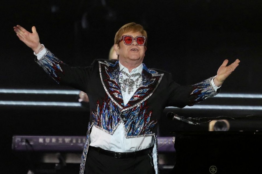 Elton John performs "Bennie and the Jets" as he wraps up the US leg of his 'Yellow Brick Road' tour at Dodger Stadium in Los Angeles, California, US, November 20, 2022. REUTERS/David Swanson