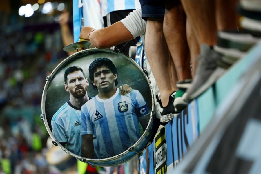FIFA World Cup Qatar 2022 - Quarter Final - Netherlands v Argentina - Lusail Stadium, Lusail, Qatar - December 9, 2022 Argentina's Lionel Messi and Diego Maradona are pictured in a fans drum inside the stadium before the match REUTERS/Molly Darlington