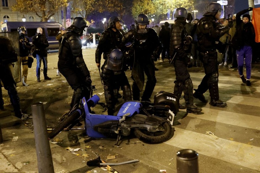 FIFA World Cup Qatar 2022 - Fans gather in Paris for Morocco v Portugal - Paris, France - December 10, 2022 Police officers are seen near a motorbike during the Morocco fans celebrations REUTERS/Benoit Tessier