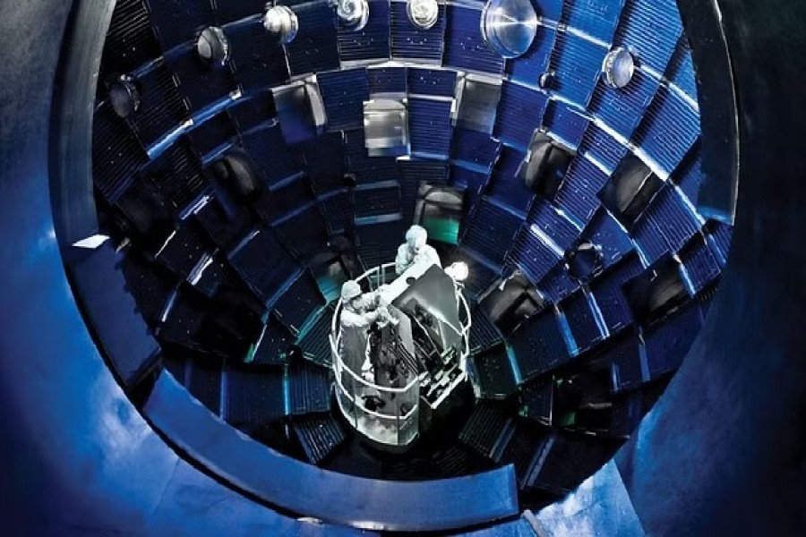 Technicians use a service system lift to access the target chamber interior for inspection and maintenance at the National Ignition Facility (NIF), a laser-based inertial confinement fusion research device, at Lawrence Livermore National Laboratory federal research facility in Livermore, California, United States in 2008. Philip Saltonstall/Lawrence Livermore National Laboratory/Handout via REUTERS