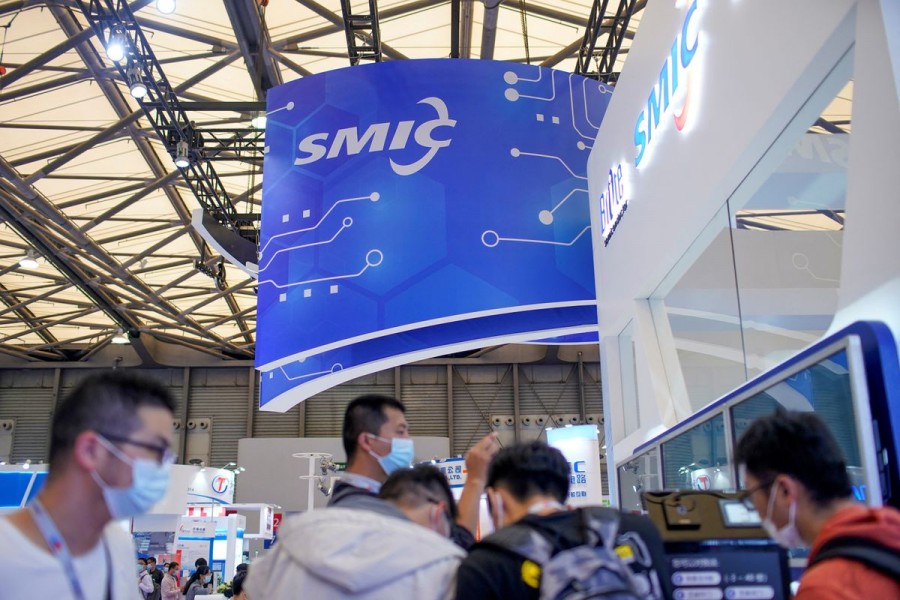 People visit a booth of Semiconductor Manufacturing International Corporation (SMIC), at China International Semiconductor Expo (IC China 2020) in Shanghai, China October 14, 2020. REUTERS/Aly Song