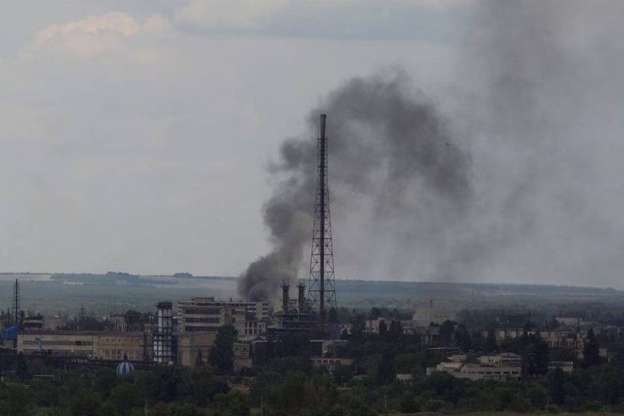 FILE PHOTO: Smoke rises after a military strike on a compound of Sievierodonetsk's Azot Chemical Plant, as Russia's attack on Ukraine continues, in Lysychansk, Luhansk region, Ukraine June 18, 2022. REUTERS
