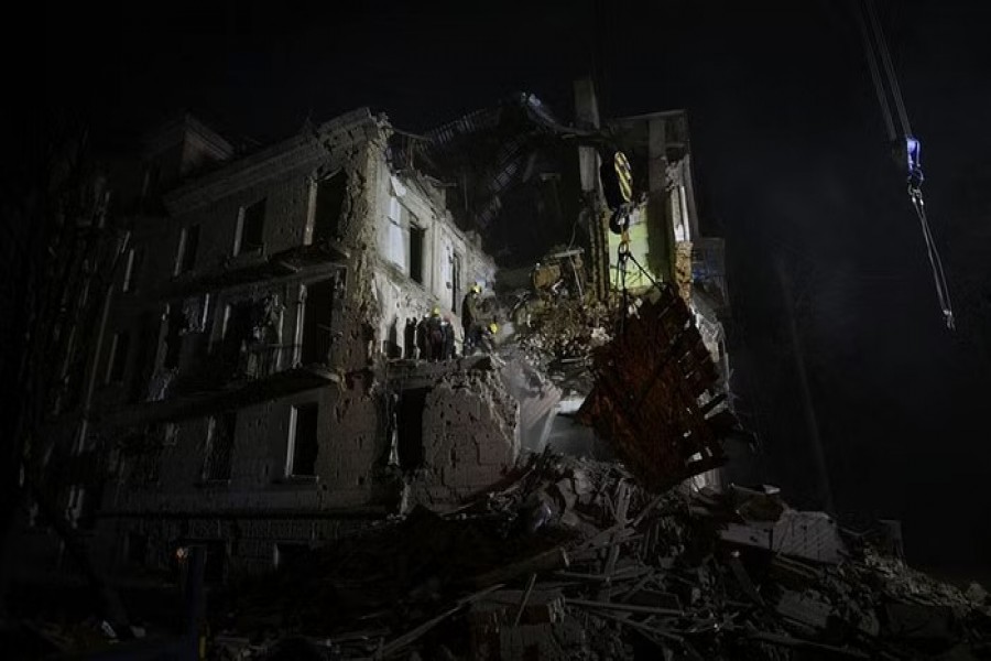 Rescuers work at the site of a residential building damaged by a Russian missile, amid Russia's attack on Ukraine, in Kryvyi Rih, Ukraine December 16, 2022. REUTERS/Mykola Synelnykov