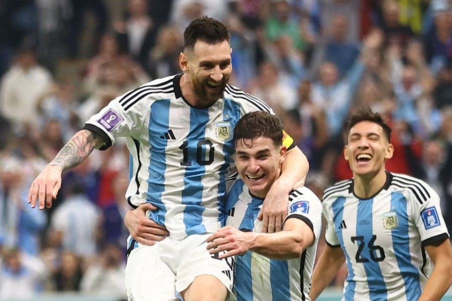 Argentina's Julian Alvarez celebrates scoring their second goal against Croatia with Lionel Messi and Nahuel Molina at Lusail Stadiul in Lusail, Qatar on December 13, 2022 — Reuters/Files