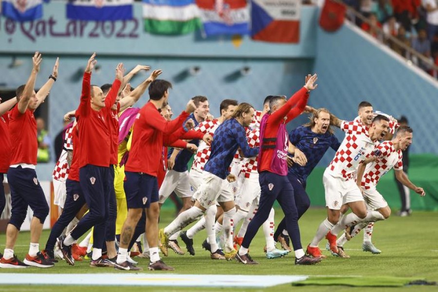Croatia players celebrate after the match as they finish in third place. REUTERS/Peter Cziborra