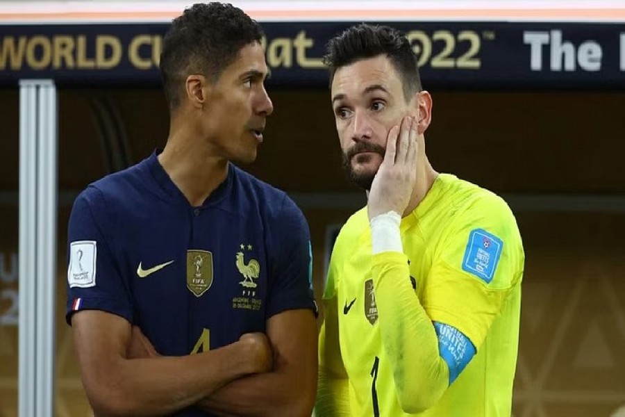 Football - FIFA World Cup Qatar 2022 - Final - Argentina v France - Lusail Stadium, Lusail, Qatar - December 18, 2022 France's Raphael Varane and Hugo Lloris look dejected after the match REUTERS