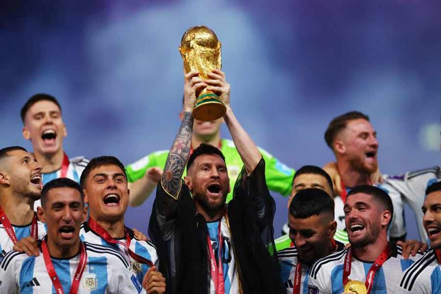 Lionel Messi hoists the World Cup after his side's victory over France in the World Cup final on Sunday at Lusail Stadium in Doha, Qatar —Reuters file photo