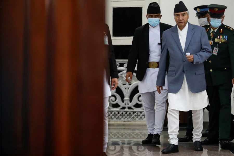 Nepal’s Sher Bahadur Deuba walking after formally assuming office of prime minister of the country at Singha Durbar office complex in Kathmandu on July 13 in 2021 –Reuters file photo