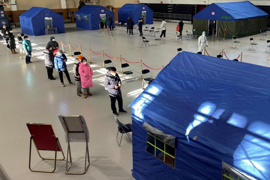 People line up at a makeshift fever clinic set up inside a stadium, amid the coronavirus disease (Covid-19) outbreak in Beijing, China on December 19, 2022 — Reuters photo