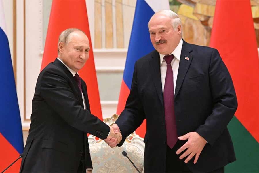 Russian President Vladimir Putin shaking hands with Belarusian President Alexander Lukashenko during a news conference following their meeting in Minsk on Monday –Reuters photo