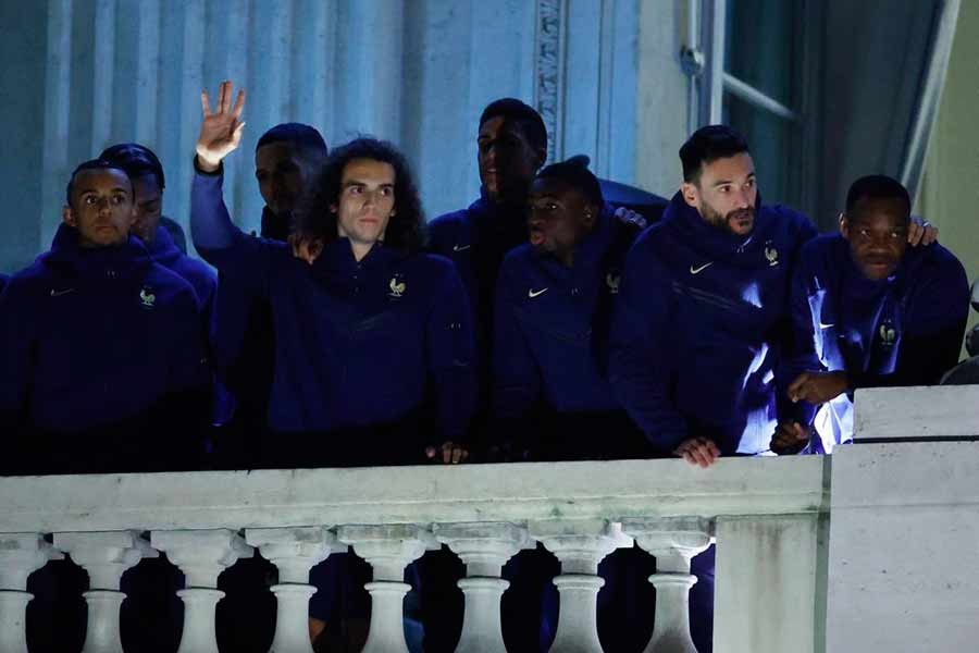 France's Matteo Guendouzi with Hugo Lloris and teammates greeting their fans from a balcony at Hotel Crillon in Paris as they returned home on Monday after losing in the World Cup Final against Argentina –Reuters photo