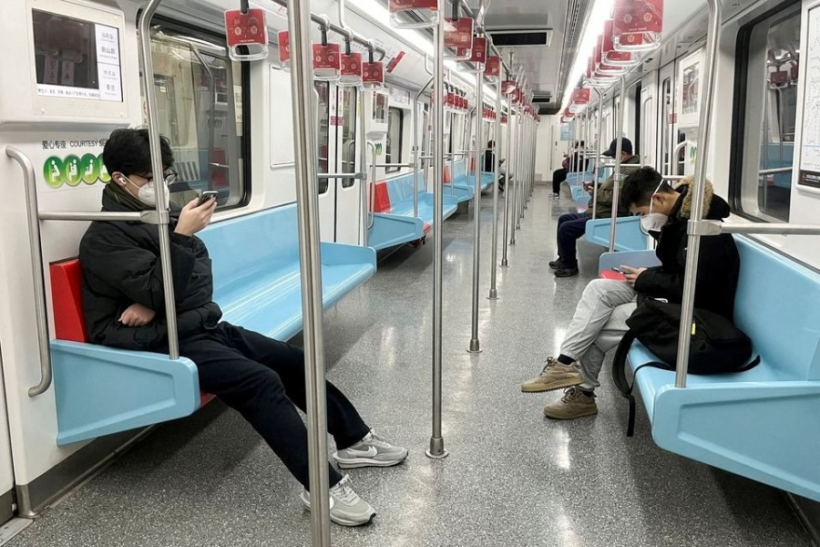 Commuters wear protective masks while they ride a subway train as coronavirus disease (Covid-19) outbreaks continue in Shanghai, China on December 20, 2022 — Reuters photo