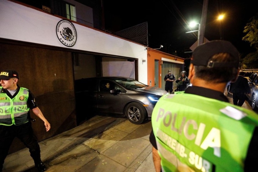 Police stand guard as a vehicle leaves the residence of Mexico's ambassador, after Peru declared Mexico's top diplomat to Lima "persona non grata" and ordered him to leave the country on Tuesday, in the latest escalation of tensions between the two nations after Peru ousted Pedro Castillo as president, in Lima, Peru on December 20, 2022 — Reuters photo