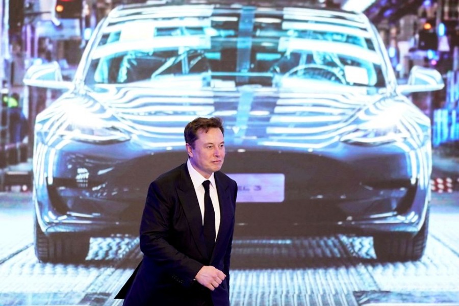 Tesla Inc CEO Elon Musk walks next to a screen showing an image of Tesla Model 3 car during an opening ceremony for Tesla China-made Model Y programme in Shanghai, China on January 7, 2020 — Reuters/Files