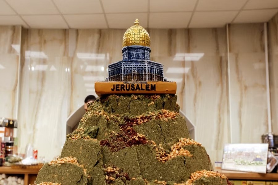 A depiction of the Dome of the Rock rests on a tower of zaatar at a spice stall in a market, Jerusalem's Old City, Dec 11, 2022. REUTERS/Ammar Awad