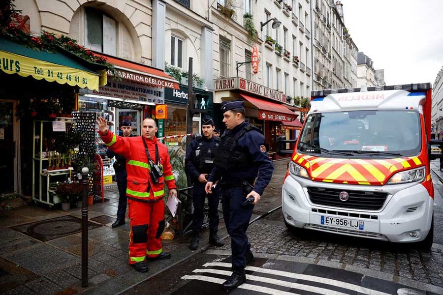 French police and firefighters securing a street after gunshots were fired killing three people and injuring several in a central district of Paris in France on Friday –Reuters photo