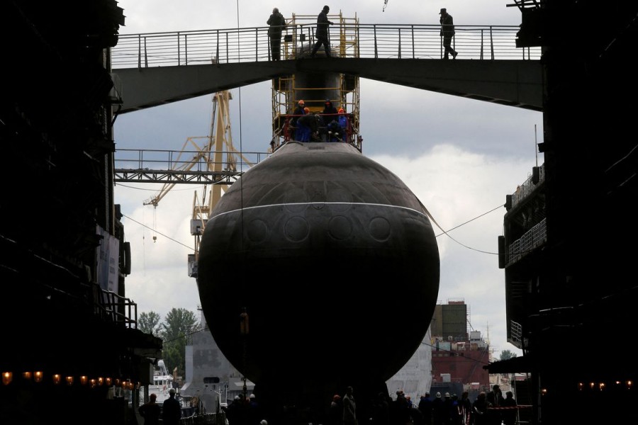 People attend a ceremony launching the diesel-electric submarine "Rostov-on-Don" at the Admiralty Shipyards in St. Petersburg, June 26, 2014. REUTERS/Alexander Demianchuk/File Photo
