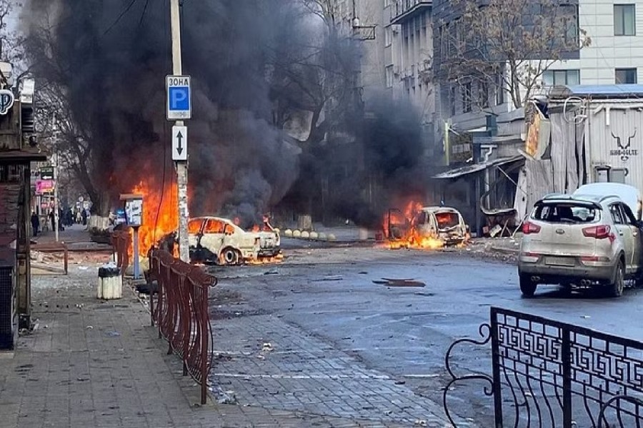 Cars burn on a street after a Russian military strike, amid Russia's attack of Ukraine, in Kherson, Ukraine December 24, 2022. Ukrainian Presidential Press Service/Handout via REUTERS