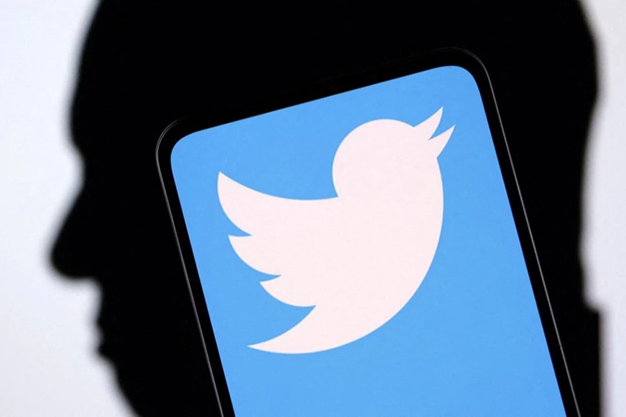 Twitter logo and Elon Musk silhouette are seen in this illustration taken on December 19, 2022 — Reuters/Files