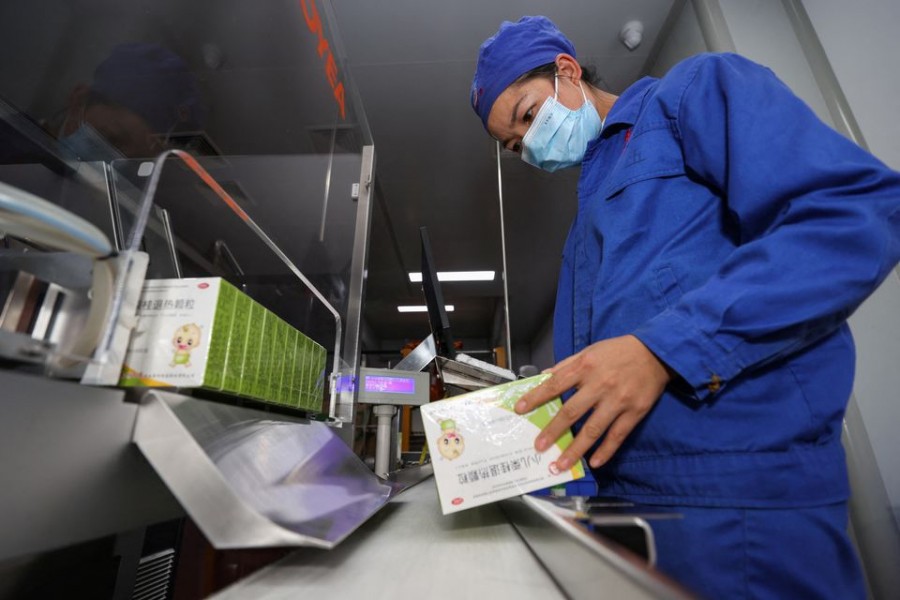 An employee works at the production line of a fever medicine at a Guizhou Bailing plant amid the coronavirus disease (Covid-19) outbreak, in Anshun, Guizhou province on December 24, 2022 — cnsphoto via REUTERS