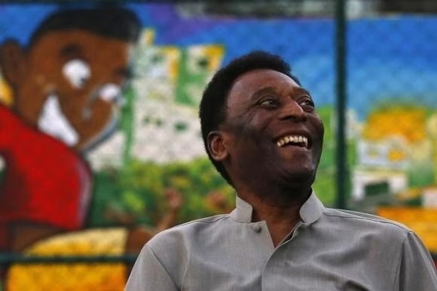 Brazilian football legend Pele laughs during the inauguration of a refurbished soccer field at the Mineira slum in Rio de Janeiro September 10, 2014. |REUTERS