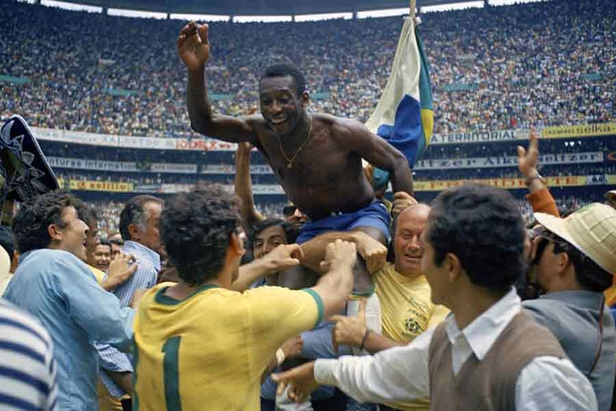 Brazil's Pele, centre, is hoisted on the shoulders of his teammates after Brazil won the World Cup soccer final against Italy, 4-1, in Mexico City's Estadio Azteca, Mexico. —AP Photo
