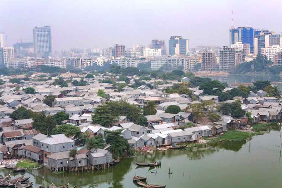 Slums next to high-rise buildings in Dhaka symbols of widening inequality in the country. —BRAC Photo